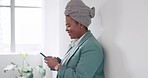 Black woman, phone and business contact while typing email, message or chat on social media while happy in a bright workplace. African entrepreneur with smartphone for networking or secret affair