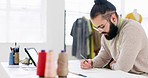 Fashion, designer and man drawing in studio, working on sketch or design. Startup, art and male small business owner from Canada in workshop designing a new brand of clothes or clothing collection.