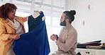Fashion design, team and dress on a mannequin being prepared for a stylish retail store. Business, fabric and fashionable man and woman making an outfit in their design studio using textile
