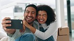 Couple, moving and selfie in new home to celebrate achievement or mortgage loan together with a phone, handheld movement and happiness. Man and woman with phone while happy in their first apartment