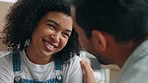 Couple, love and smile for care, conversation or talking together in relationship relaxing at home. Happy woman and man smiling in communication, discussion or romance for comfort or bonding support 