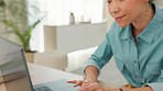 Laptop, black woman and typing at table in work from home office, internet research and seo technology. Female freelancer, social media blog and remote working on computer, email and website at desk