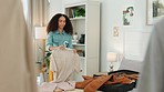 Holiday packing, black woman and luggage at home with person holding vacation clothing. Bedroom, woman and travel female ready for a adventure, journey or cruise with a suitcase and bag in a house