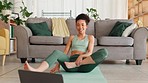 Black woman, laptop and fitness online class in home for fitness workout, pilates exercise or stretching body on floor. African woman, web training tutorial and yoga wellness on digital tech device