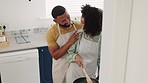 Love, black couple talking and cooking in kitchen, bonding and having fun. Food, chef and romantic man and woman in discussion in house, embrace and communication while enjoying quality time together