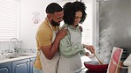 Cooking, food and young couple in kitchen for lunch, meal or dinner with love, care or happiness together. Black man hug happy woman at stove, modern house and prepare for eating, relax and lifestyle