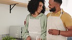 Love, black couple and drinking wine while cooking in kitchen, bonding and talking. Food, romance and man and woman with alcohol cutting vegetables and preparing delicious and healthy meal in house.