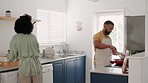 Love, wine and couple in kitchen cooking, drinking and spending time together in home. Home cooking, happy man and woman with wine glass, smile and apron, black couple making dinner in modern house.