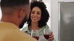 Black couple, kitchen and cooking with wine, toast and happy for love, romance and food in home. Happy couple, black woman and man with wine glass, happiness and bonding at anniversary celebration