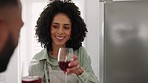 Wine, toast and couple in the kitchen to cook a meal for date, dinner or lunch at their home. Happy smile, man and woman in drinking alcohol beverage while cooking food with cheers, drink or bonding
