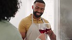 Drinking, wine toast and black couple cooking in kitchen, having fun and bonding. Love, chef and happy man and woman cheers with alcohol while preparing a delicious, gourmet and healthy meal in house