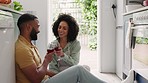 Happy couple, wine and toast on kitchen floor with smile, drink together and love conversation in home. Black couple. wine glass and happiness for celebration, relax and bonding at house in Atlanta