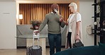 Travel, communication and business people holding hands for partnership, professional teamwork and executive work with luggage. Support, smile and diversity of couple of employees talking at a hotel