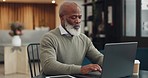 Senior, black man and typing on laptop in coffee shop, research or social media. Cafe, tech and elderly businessman from Nigeria on pc working on online project, thinking and writing email at table.