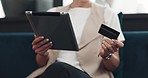 Woman, tablet and credit card for ecommerce, online shopping and paying bills while on a couch reading details or information for payment. Hands of female doing online banking with wifi network