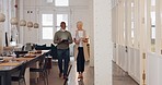 Elderly, creative business people and tablet walking in the office in project discussion, planning or corporate startup. Senior man and woman having a walk and talking in conference or boardroom