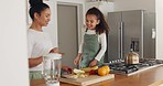 Family, fruit and healthy lifestyle with mother and daughter making smoothie in home kitchen with happiness, love and fun laughing and playing. Woman and girl child together for breakfast in blender