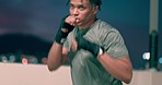 Boxing, fitness and mma black man on city rooftop at night for exercise, speed and power workout with focus, energy and action. Dark urban bokeh, sports and boxer training outdoor for a competition