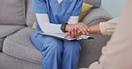 Nurse, patient and holding hands for healthcare consultation in office for cancer news, grief support or mental health care. Medical worker, consulting woman and empathy trust or communication 