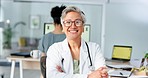 Healthcare, arms crossed and doctor with computer email, reading communication and medical pride in a hospital office. Medicine consultant, research and portrait of a mature worker on the internet