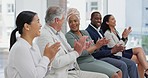 Applause, conference and seminar with diversity business people sitting in a line or row during a presentation. Meeting, thank you and workshop with a man and woman employee group clapping together