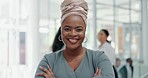 Portrait, happy and confidence with a business black woman standing arms crossed in her office. Face, smile and leadership with a female employee at work in a corporate or professional workplace