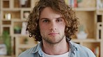 Face, front and man with curly hair on creative office background for future growth for entrepreneurship vision, goal and mission. Portrait of young gen z male from Australia with black expression
