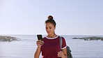 Happy woman, phone and beach with a backpack for exchange student travel, communication and GPS for location using social network. Gen z female with smartphone at sea for online mobile app outdoor