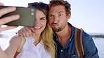 Couple, funny face and phone selfie, picture and social media post outdoor at beach, holiday and travel in Italy. Young man, woman and photo with mobile smartphone at ocean, sea and happy vacation