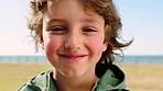 Face, smile and kid at beach park on vacation, holiday or trip with fresh breeze. Freedom, travel or portrait of happy boy from Canada smiling, having fun or enjoying quality time outdoors by seaside