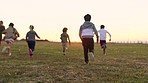 Children group, running and field for play race, game and happiness in summer with friendship diversity. Happy group, kids and park with grass lawn for sunshine, fast and multicultural games in Miami