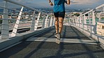 Man, legs or running on city bridge for healthcare wellness, cardiology strength or marathon training in slow motion. Sports athlete, runner or fitness person in urban Boston exercise and speed goals