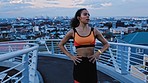 Fitness, running and woman in a city at night for training, sport and wellness with music for motivation on a bridge. Runner, girl and run workout with energy, speed and intense practice with podcast