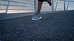 Woman, running shoes or city bridge workout, training or exercise for sunrise cardiology, healthcare wellness or body goals. Zoom, legs or sports runner with fitness sneakers in slow motion marathon