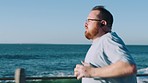 Fitness, fat or man running at a beach to lose weight in cardio training, exercise or workout in Los Angeles, USA. Goals, obesity or plus size runner exercising with earphones for health motivation