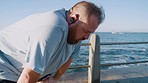Fitness, breathe and man by ocean after running for weightloss, healthy lifestyle and body wellness. Sports, endurance and plus size male relax after workout, exercise and cardio training by seaside