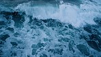 Drone view, beach or water waves at sunset in travel location, tropical environment or sustainability Canada nature. Aerial, ocean or sea with washing tides on rocks at sunrise for zen, calm or peace