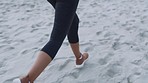 Beach, fitness and feet running on sand for marathon training, exercise and cardio workout in nature. Sports, healthy lifestyle and legs of woman on beach sand for endurance challenge, jog and sprint