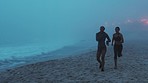 Beach running, race and tired fitness woman tired in a marathon challenge with sea fog. Runner workout, performance and cardio exercise for health with athlete fatigue in outdoor competition