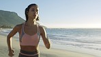 Beach, running and woman by the ocean for fitness, workout and exercise for runner health. Sports, marathon training and cardio energy of a athlete by the sea and ocean on a morning run outdoor