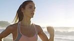 Fitness, beach and woman running for cardio exercise, healthy lifestyle or summer workout in sunshine with focus, motivation and energy. Female runner, sports and training at sea for wellness goals 