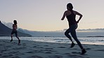 Women, fitness and running on beach at sunset in Hawaii for wellness, health and training. Cardio exercise and marathon practice of people at ocean with focus, speed and concentration.

