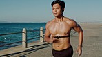 Running, fitness and Asian man with music for training motivation, cardio power and energy on the promenade in Portugal. Exercise, wellness and runner with outdoor workout for health with speed