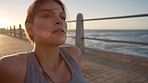 Fitness, beach and woman resting after a workout on the promenade for a maternity exercise. Sports, breathing and pregnant lady runner relaxing after outdoor cardio training for a race or marathon.