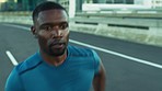 Black man, running and speed with fitness on city bridge, exercise and focus with energy. Training for marathon, triathlon or race. Challenge, runner in street with sports workout and sweat outdoor.