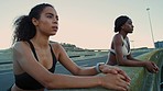 Black women, breathing or fitness break on city bridge, road or street in sunrise workout, training or exercise. Friends, runners or sports people resting after sunset marathon running for healthcare