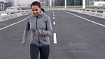 Running, exercise and woman on break in city after workout for health and wellness. Sports fitness, winter and tired, fatigue and exhausted female resting after jog, training or exercising on street.