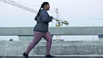 Running, fitness and plus size black woman in the city street, health training and music for motivation in Switzerland. Exercise, cardio and an African runner with a podcast for workout energy