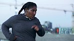 Plus size, black woman and running in urban city with motivation to lose weight, wellness goals or healthy lifestyle. Cardio fitness, runner and body fat training workout for obesity, energy or power