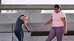 Fitness, exercise and fat woman with personal trainer in city for warm up, workout and cardio training to lose weight for health and wellness. Friends or India women talking outdoor after running